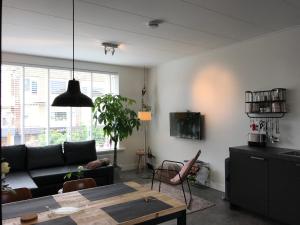 a living room with a couch and a table at Pakhuis 5 in Katwijk aan Zee