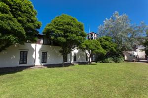 an exterior view of a house with trees in the yard at Europa Gatwick Hotel in Crawley +51 photos