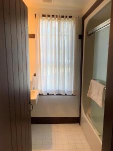 a bathroom with a sink and a window at Shaker Village of Pleasant Hill in Harrodsburg