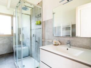 a bathroom with a sink and a shower at Sa Costa in La Caletta