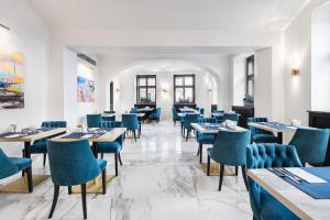 Reštaurácia alebo iné gastronomické zariadenie v ubytovaní Áurea Legends by Eurostars Hotel Company