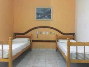 Lova arba lovos apgyvendinimo įstaigoje Hotel Solar Flores