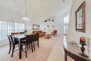 a dining room and living room with a table and chairs at 4 Corners Getaway in Davenport