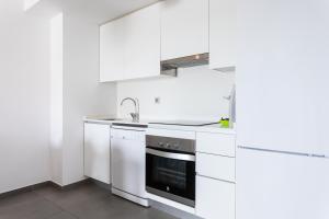 Kuchyňa alebo kuchynka v ubytovaní Apartamentos Las Terrazas de Sotavento
