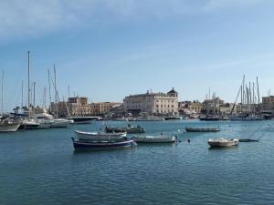a group of boats in the water in a harbor at Lakkios charming suites and rooms in Siracusa