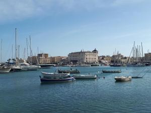 a group of boats in the water in a harbor at Lakkios charming suites and rooms in Syracuse
