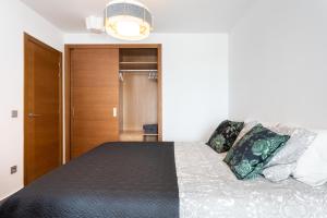 Posteľ alebo postele v izbe v ubytovaní Apartamentos Las Terrazas de Sotavento