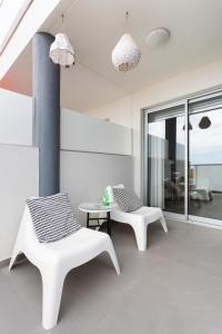 Posedenie v ubytovaní Apartamentos Las Terrazas de Sotavento