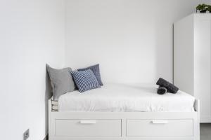 Posteľ alebo postele v izbe v ubytovaní Apartamentos Las Terrazas de Sotavento