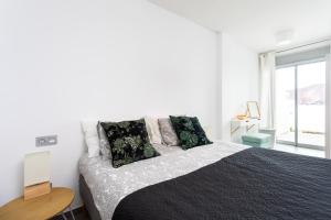 Posteľ alebo postele v izbe v ubytovaní Apartamentos Las Terrazas de Sotavento + 37 fotografií