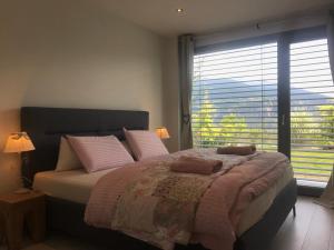 Postel nebo postele na pokoji v ubytování bnb Valais - by La Sittelle