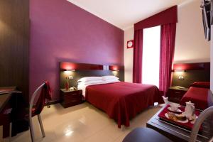 Postel nebo postele na pokoji v ubytování Hotel Ideale