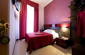 Postel nebo postele na pokoji v ubytování Hotel Ideale
