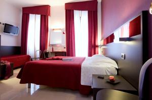 Postel nebo postele na pokoji v ubytování Hotel Ideale