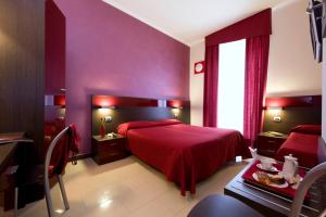 Postel nebo postele na pokoji v ubytování Hotel Ideale