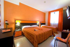 Postel nebo postele na pokoji v ubytování Hotel Ideale