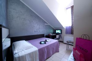 Postel nebo postele na pokoji v ubytování Hotel Ideale