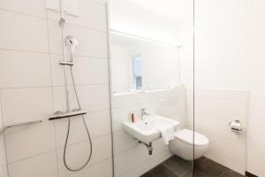 Koupelna v ubytování Wallner - Hotel & Wirt + 37 fotografií