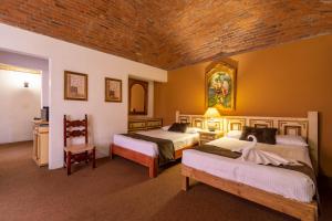 Un ou plusieurs lits dans un hébergement de l'établissement Hosteria del Frayle