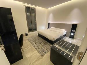 Ліжко або ліжка в номері Sadan Furnished Apartments