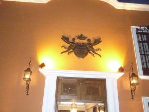 a spider on the wall above a doorway in a room at Hotel Hacienda de los Ángeles by Rotamundos in Comitán