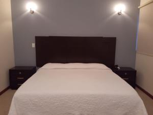 Cama o camas de una habitación en HOTEL CANDELERO