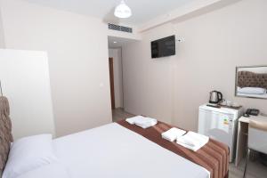 Postel nebo postele na pokoji v ubytování BEKSİTİ HOTEL