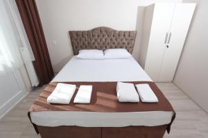 Postel nebo postele na pokoji v ubytování BEKSİTİ HOTEL