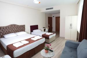 Postel nebo postele na pokoji v ubytování BEKSİTİ HOTEL
