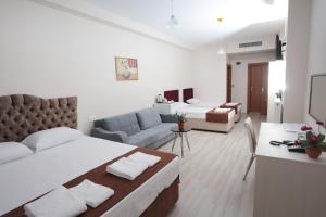 Postel nebo postele na pokoji v ubytování BEKSİTİ HOTEL