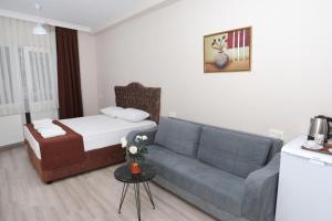 Postel nebo postele na pokoji v ubytování BEKSİTİ HOTEL