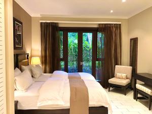 A bed or beds in a room at Eden Island Luxury Apartment - P14A3
