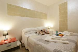 Postel nebo postele na pokoji v ubytování White Suite B&B