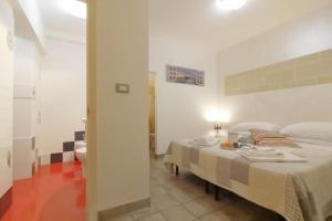 Postel nebo postele na pokoji v ubytování White Suite B&B