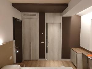 Letto o letti in una camera di Albergo Baschera