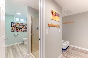 a bathroom with a shower and a toilet at Tree Top Oasis in Truro +30 photos