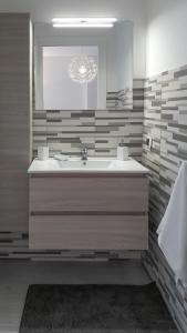 a bathroom with a tub and a sink and a window at Casa Giovanni in Bergamo +27 photos