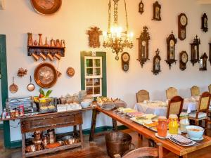 a room with a table with food on it at Pousada da Marquesa in Paraty