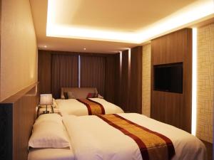 竹林雅致商务汽车旅馆客房内的一张或多张床位