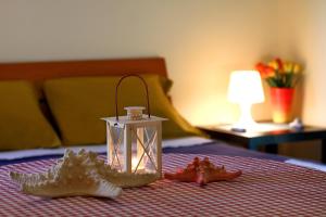 Uma cama ou camas num quarto em Lighthouse Apartments