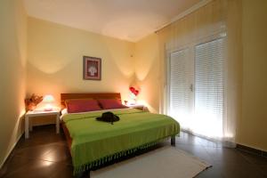 Uma cama ou camas num quarto em Lighthouse Apartments
