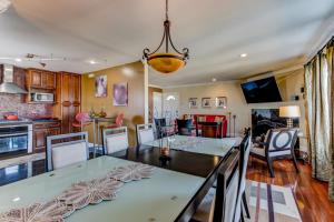 a kitchen and dining room with a table and chairs at House-Canyon Dr in Oceanview