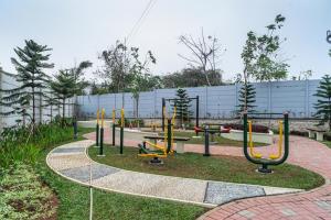 a park with a bunch of playground equipment at RedDoorz Plus @ EcoHome Citra Raya Tangerang in Tangerang