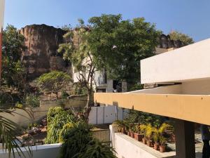 a view from a building with a mountain in the background at Kalpana Yoga Homestay in Jaipur