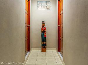 a statue of a woman in a hallway at Hotel Kata Hill Sea View in Kata Beach
