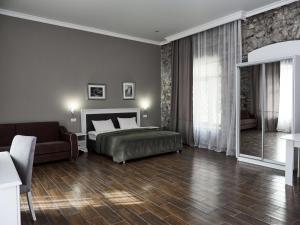 Un pat sau paturi într-o cameră la Hotel Abaata