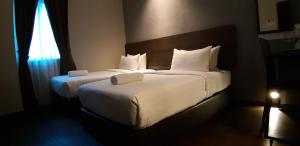Voodi või voodid majutusasutuse MIICO Hotel @ Mount Austin toas
