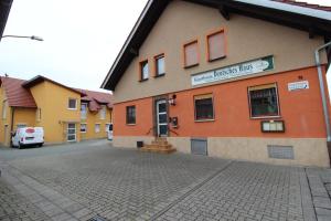 a building with a street in front of it at Gasthaus Deutsches Haus in Schifferstadt