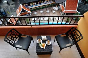 En balkong eller terrasse på Suppamitr Villa Hotel