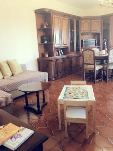 a living room with a couch and tables at Villa Sofia in Pramaggiore